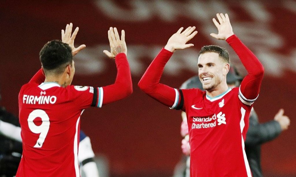 SELEBRASI: Kapten Liverpool Jordan Henderson (kanan) melakukan selebrasi bersama pencetak gol penentu kemenangan atas Tottenham Hotspur, Roberto Firmino. (ANTARA/LINGKAR JATENG)