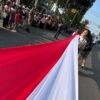 Nyalakan Nasionalisme, Merah Putih Sepanjang 100 Meter Terbentang di Karnaval Paskah Kota Semarang